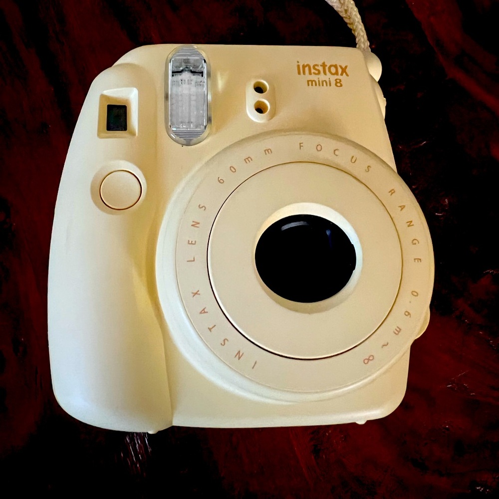 Instax Camera with carrying case. Great for on the spot photos, like a Polaroid